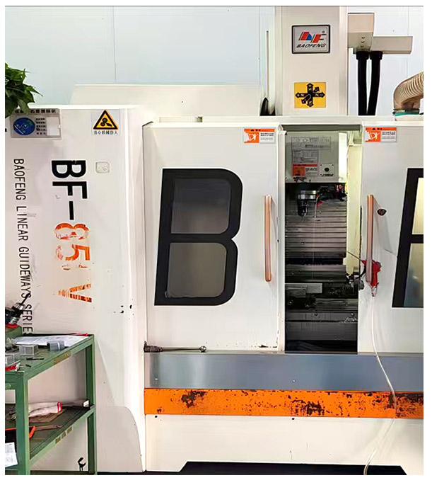 Four-axis CNC machining center